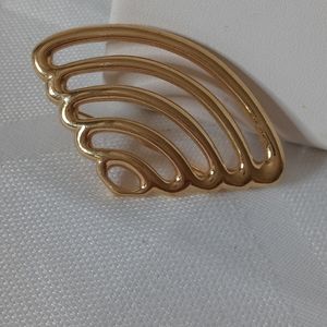 Monet gold tone brooch